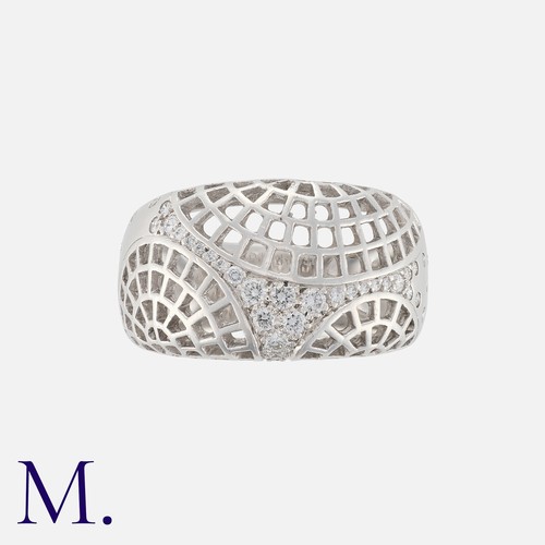 111 - CARTIER, A Nouvelle Vague Diamond Ring in 18k white gold, the openwork lattice form, set with round ... 