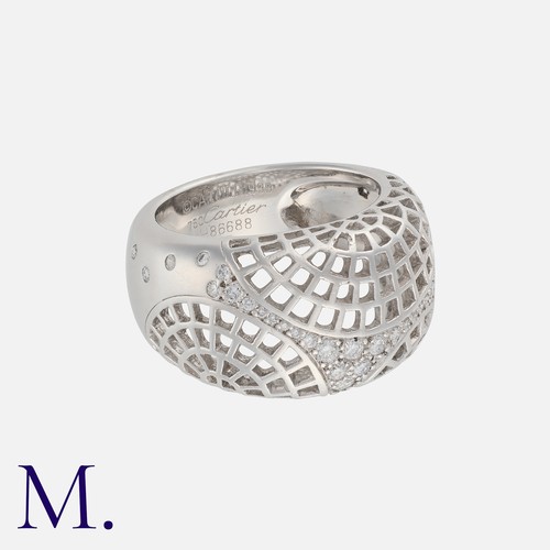 111 - CARTIER, A Nouvelle Vague Diamond Ring in 18k white gold, the openwork lattice form, set with round ... 