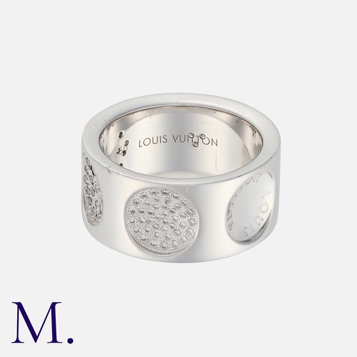 96 - Louis Vuitton, An Empreinte Ring in 18k white gold, the wide band punctuated with concave, diamond s... 