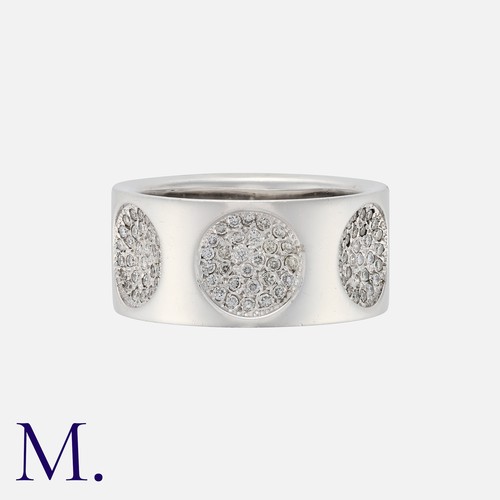 96 - Louis Vuitton, An Empreinte Ring in 18k white gold, the wide band punctuated with concave, diamond s... 