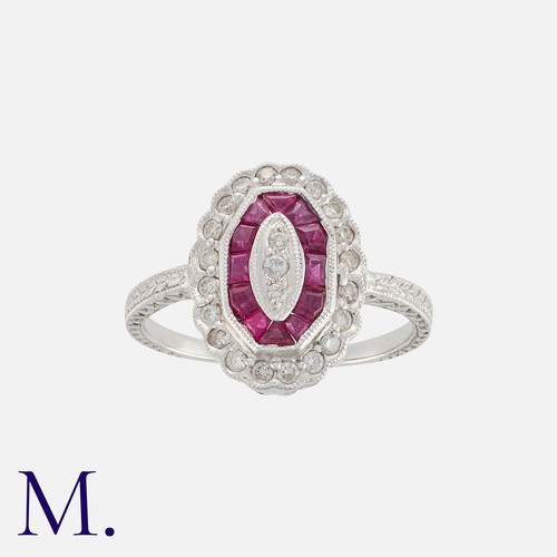 64 - NO RESERVE. A Ruby and Diamond Ring in white gold, set with calibrated rubies and diamonds. Stamped ... 