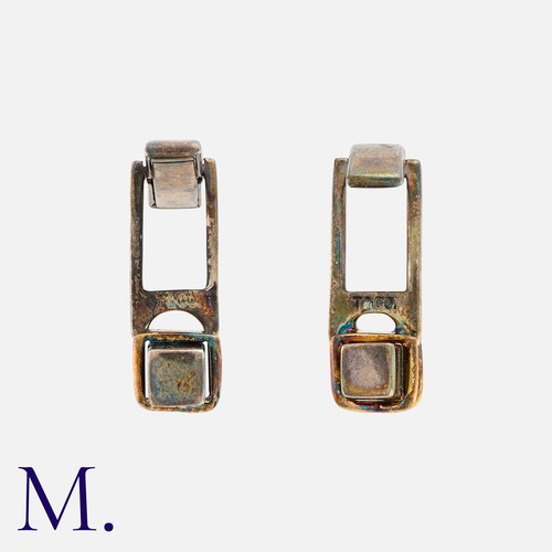 170 - NO RESERVE. TIFFANY & CO. A Pair of Cufflinks in silver with yellow gold 'X' accents.  Signed T&Co. ... 