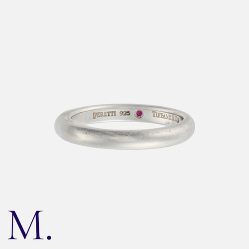 186 - NO RESERVE. TIFFANY & CO. A Ruby Band in silver, set with a flush-set round cut ruby.  Signed Tiffan... 