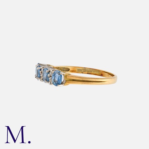 126 - NO RESERVE. A Blue and White Gemstone Ring in 18K yellow and white gold.  Set with four blue gemston... 