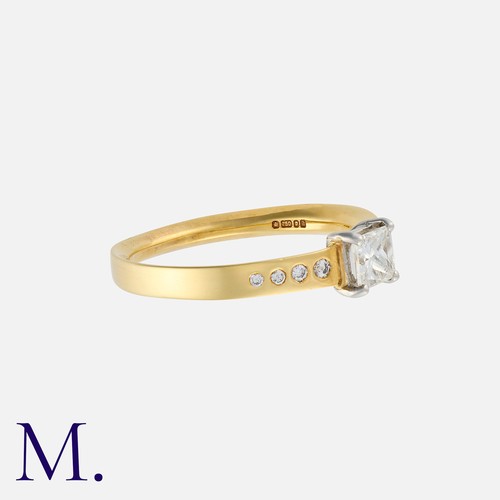 28 - A Diamond Solitaire Ring in 18K yellow and white gold, set with a princess cut diamond weighing 0.40... 