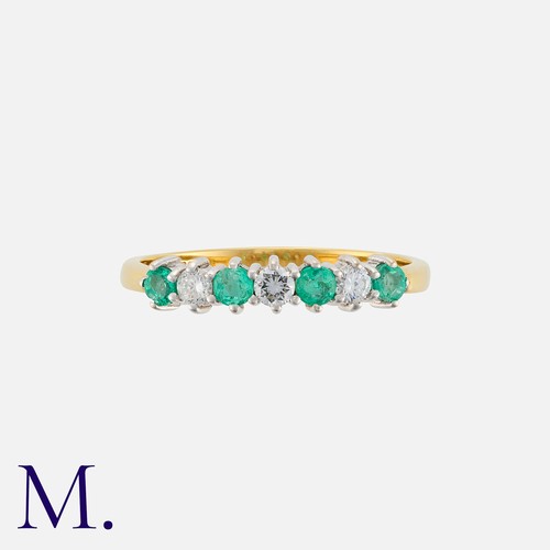 65 - An Emerald and Diamond Ring in 18K yellow and white gold, set with four emeralds weighing approx. 0.... 