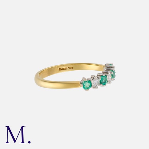 65 - An Emerald and Diamond Ring in 18K yellow and white gold, set with four emeralds weighing approx. 0.... 