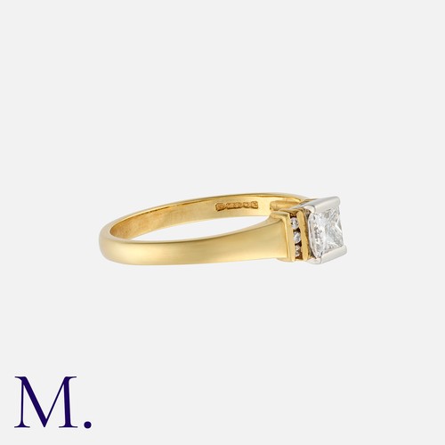 95 - A Diamond Solitaire Ring in 18K yellow and white gold, set with a princess cut diamond weighing 0.43... 