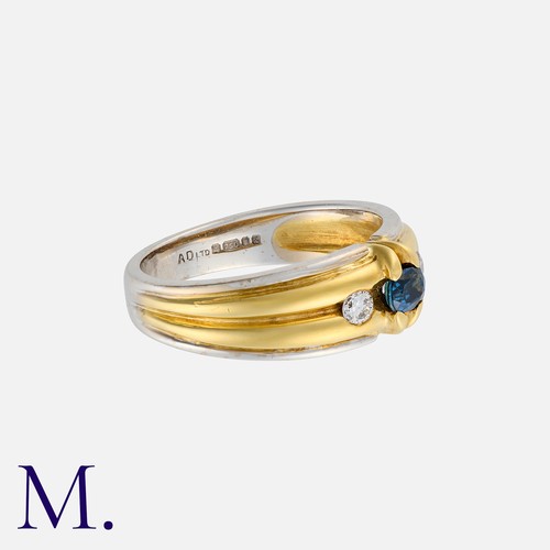 161 - A Sapphire and Diamond Ring in 18K yellow and white gold, set with an oval-cut sapphire weighing app... 