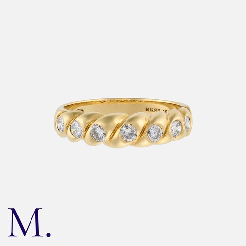 154 - A Diamond Ring in 18K yellow gold, set with seven round brilliant cut diamonds (estimated G colour /... 