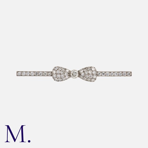 94 - A Diamond Brooch in platinum, designed as a bow, set with round cut diamonds totalling approximately... 