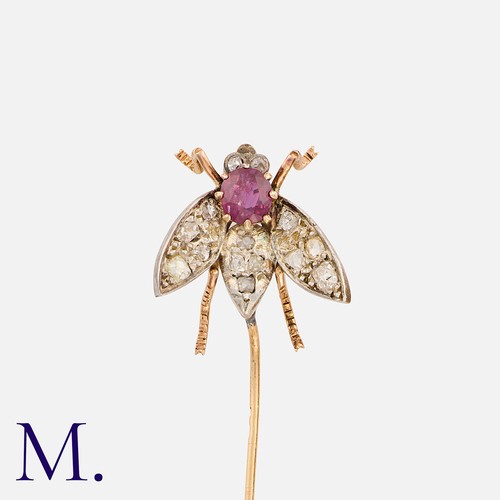 223 - An Antique Insect Pin in yellow gold and silver, set with a round cut ruby with old cut and rose cut... 