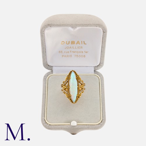 139 - An Art Nouveau Opal and Diamond Ring in 18K yellow gold, with a large marquise-shaped opal with exce... 