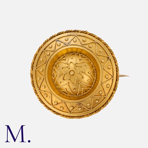 92 - An Antique Brooch in yellow gold, of Etruscan revival style, the domed form decorated with fine gran... 