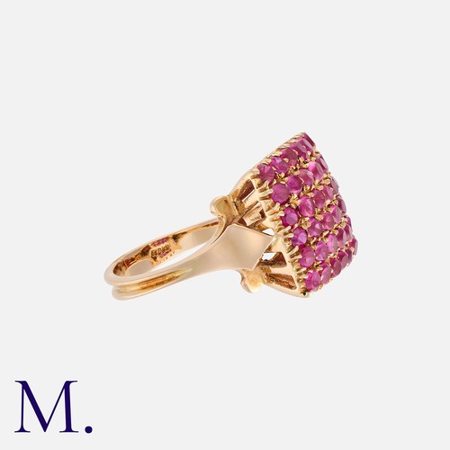 90 - A Ruby Ring in yellow gold, of square form, set with six rows of round cut rubies. Mark indistinct b... 