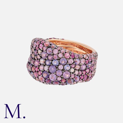 51 - A Pink Sapphire Ring in 14k rose gold, set throughout with round cut pink sapphires. Marked 14k.

Si... 