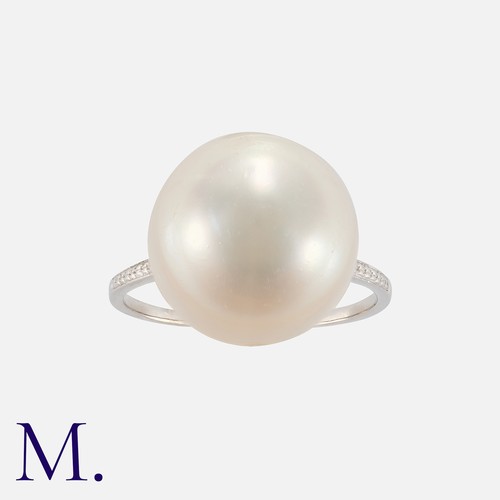 13 - A Pearl Ring in platinum, set with a large untested pearl of approximately 15mm X 12mm. Unmarked but... 