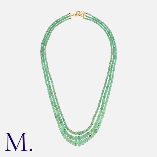 91 - An Emerald Necklace in yellow gold, comprising three graduated rows of faceted emerald beads. Unmark... 