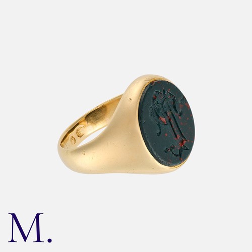 203 - An Antique Bloodstone Signet Ring in 18K yellow gold, set with an oval bloodstone with monogram inta... 