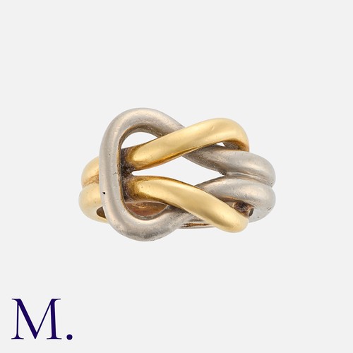 34 - A Gold Knot Ring in 18K yellow and white gold. Stamped '750' inside the band with French import mark... 