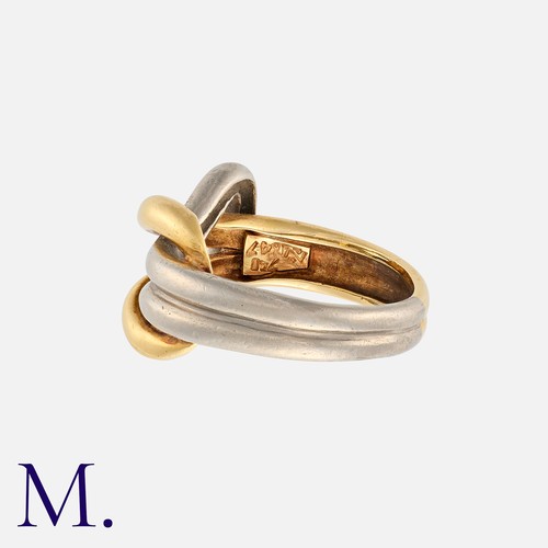 34 - A Gold Knot Ring in 18K yellow and white gold. Stamped '750' inside the band with French import mark... 