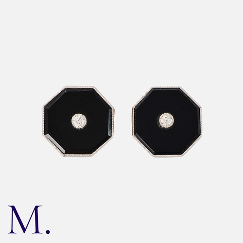 53 - A Pair of Art Deco Onyx and Diamond Earrings in 18K gold and platinum.  Set to the centre with old c... 