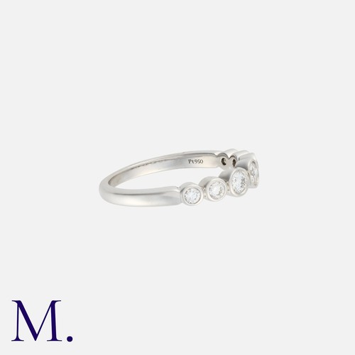 60 - A Platinum and Diamond Jazz Ring by Tiffany & Co.

There is an estimated total diamond weight of 0.3... 