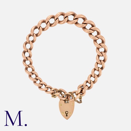 11 - An Antique Curb Bracelet in 9K rose gold.  Secured with heart-shaped padlock.  Marked '375' for 9ct ... 