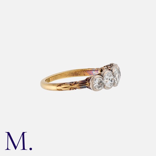 1 - A Diamond Five Stone Ring in 18k yellow gold, set with five old cut diamonds totalling approximately... 