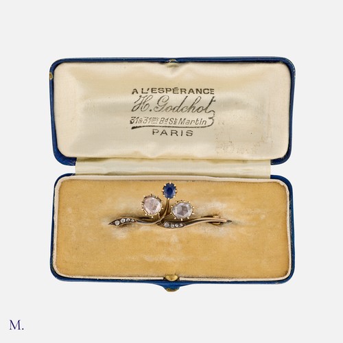 16 - A Rose Cut Diamond And Sapphire Brooch in yellow gold, of foliate design, set with two large rose cu... 