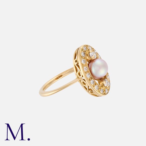 76 - A Pearl And Diamond Ring in yellow gold, set centrally with a round pearl of approximately 5.8mm fla... 