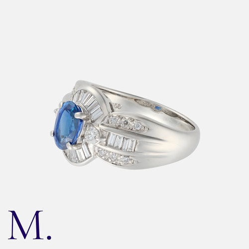 47 - A Sapphire And Diamond Ring in platinum, set with a principal oval cut sapphire of approximately 1.1... 