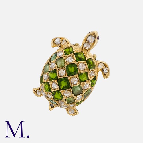 64 - A Demantoid Garnet, Diamond And Ruby Pendant, in yellow gold, designed as a turtle, the chequerboard... 