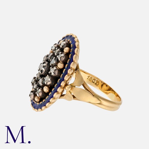 145 - An Enamel And Diamond Ring in 18k yellow gold, set with a cluster of rose cut diamonds within a blue... 