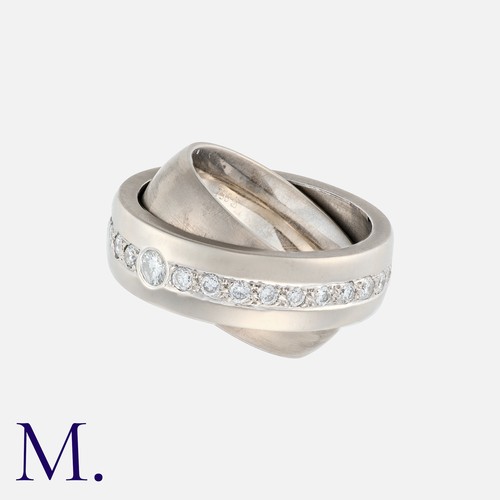 56 - An Articulated Diamond Eternity Ring in 18k white gold, comprising two bands, one concave, and one c... 