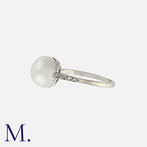 105 - A Natural Pearl And Diamond Ring in 18k white gold, set with a principal natural saltwater pearl of ... 