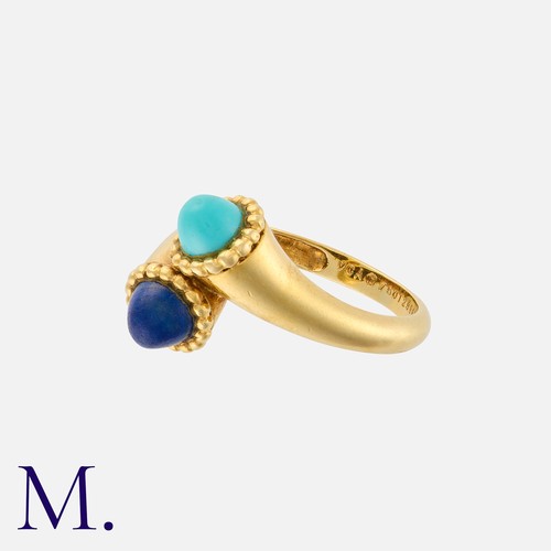 57 - VAN CLEEF & ARPELS. A Turquoise and Lapis Lazuli Ring in 18ct yellow gold in a cross-over style.  Si... 