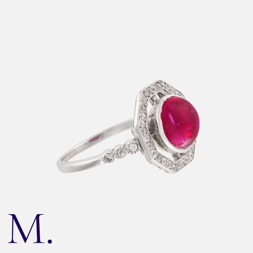 103 - An Art Deco Burma Ruby and Diamond Ring in platinum, set with a cabochon ruby (with a laboratory not... 