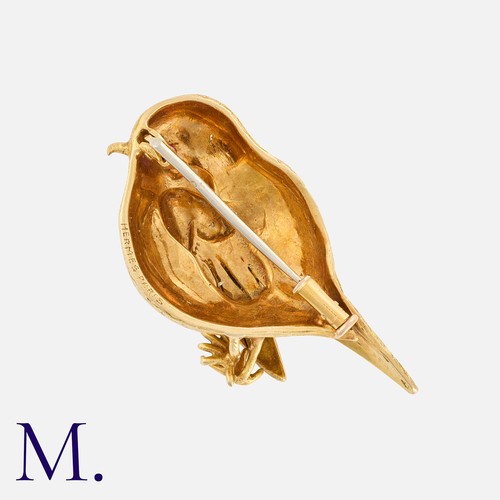 58 - HERMES. A Vintage Bird Brooch in 18K yellow gold with a ruby eye, signed Hermes Paris to the reverse... 