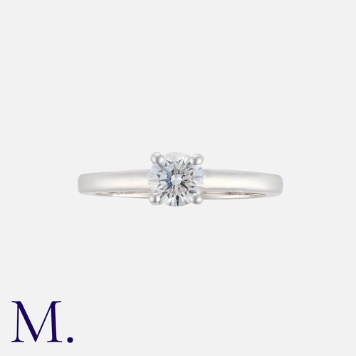 199 - A Diamond Solitaire Ring in 14k white gold, set with a principal round cut diamond of approximately ... 