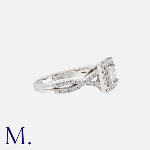 83 - A Diamond Ring in 18k white gold, set with a principal princess cut diamond of approximately 0.25ct,... 