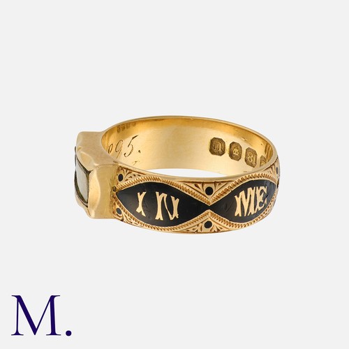 138 - An Enamel And Hairwork Mourning Ring in 18k yellow gold, the wide engraved band with enamel decorati... 