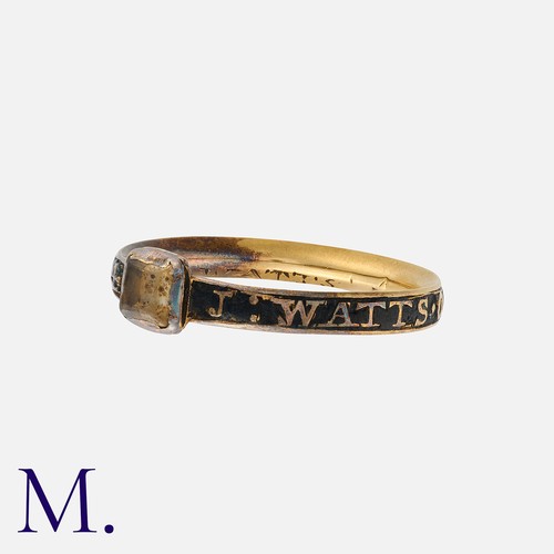 209 - An Antique Enamel And Rock Crystal Mourning Ring in yellow gold, featuring a faceted rock crystal, t... 