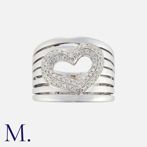 186 - A Diamond Ring in 18k white gold, comprising seven bands, a diamond set heart motif to the centre, d... 