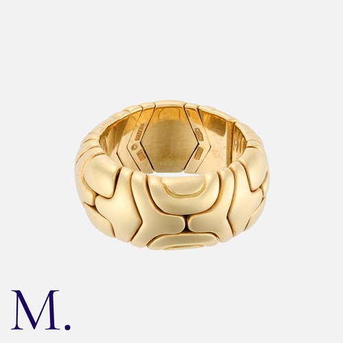 87 - BULGARI, An Alveare Ring in 18k yellow gold, the flexible geometric band. Signed Bulgari, 1989, mark... 