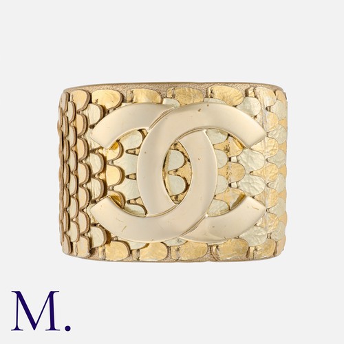 88 - CHANEL, Metallic Calfskin Scale CC Cuff Bracelet, featuring metallic leather 'scales' featuring a la... 