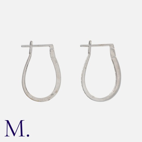 126 - A Pair of Diamond Hoop Earrings in white gold, set with baguette cut diamonds.

Size: 2.2cm
Weight: ... 