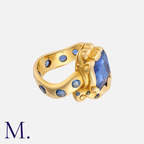 163 - A Ceylon Sapphire Snake Ring in 18K yellow gold, set with a cushion-cut sapphire (accompanied with a... 