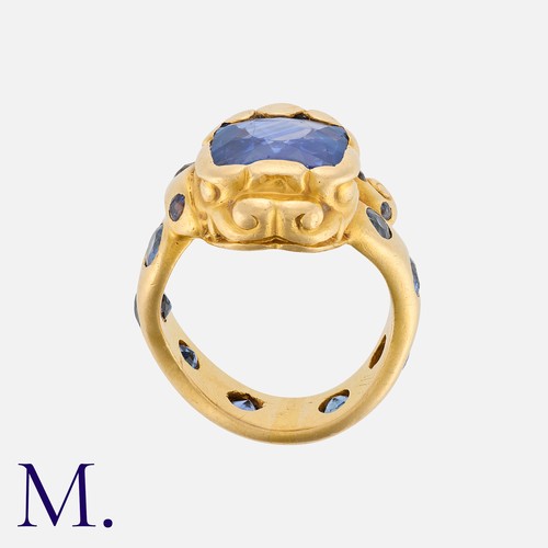 163 - A Ceylon Sapphire Snake Ring in 18K yellow gold, set with a cushion-cut sapphire (accompanied with a... 