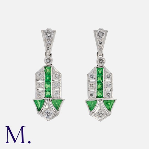 93 - A Pair of Tsavorite Garnet and Diamond Earrings in white gold, each set with calibrated tsavorite ga... 